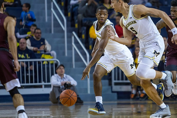 Xavier Simpson (3) and D.J. Wilson (5)