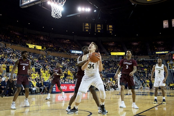 Mark Donnal (34) and Xavier Simpson (3)