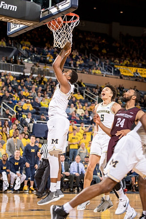 Zak Irvin (21) and D.J. Wilson (5)