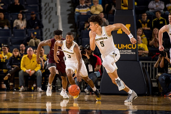 Xavier Simpson (3) and D.J. Wilson (5)