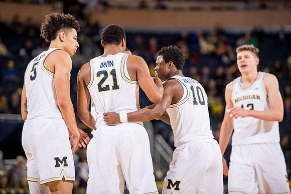 D.J. Wilson (5), Zak Irvin (21), Derrick Walton Jr. (10), and Moritz Wagner (13)