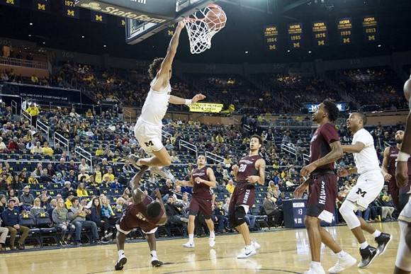 D.J. Wilson (5) and Muhammad-Ali Abdur-Rahkman (12)