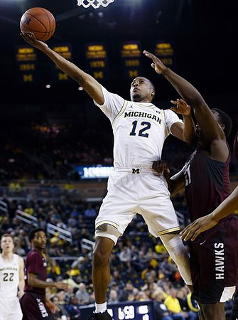 Duncan Robinson (22) and Muhammad-Ali Abdur-Rahkman (12)