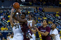Mark Donnal (34), Derrick Walton Jr. (10), and Muhammad-Ali Abdur-Rahkman (12)