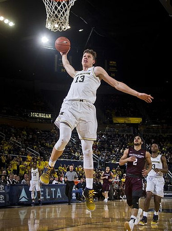 Moritz Wagner (13), Derrick Walton Jr. (10), and Xavier Simpson (3)