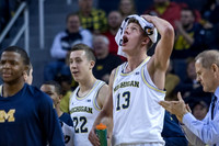 Xavier Simpson (3), Duncan Robinson (22), Moritz Wagner (13), and John Beilein