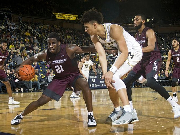 D.J. Wilson (5) and Muhammad-Ali Abdur-Rahkman (12)