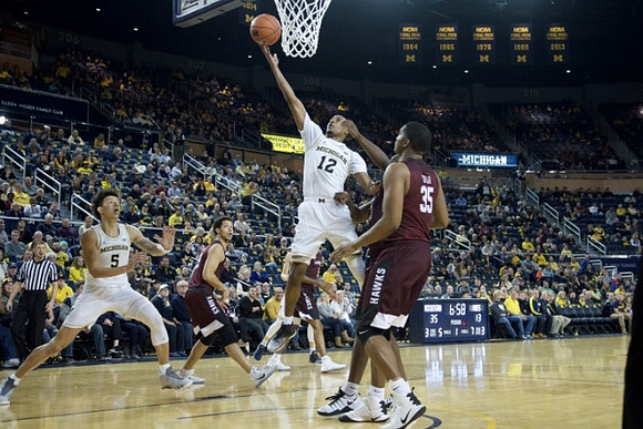D.J. Wilson (5) and Muhammad-Ali Abdur-Rahkman (12)