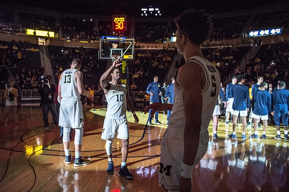 Moritz Wagner (13), Derrick Walton Jr. (10), and D.J. Wilson (5)