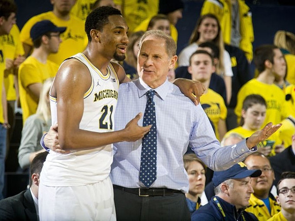 Zak Irvin (21) and John Beilein