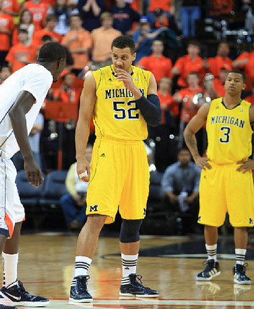 Jordan Morgan (52) and Trey Burke (3)