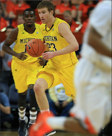 Tim Hardaway Jr. (10) and Evan Smotrycz (23)
