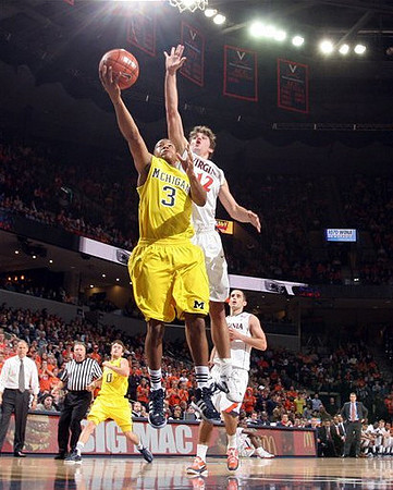 Trey Burke (3) and Zack Novak (0)