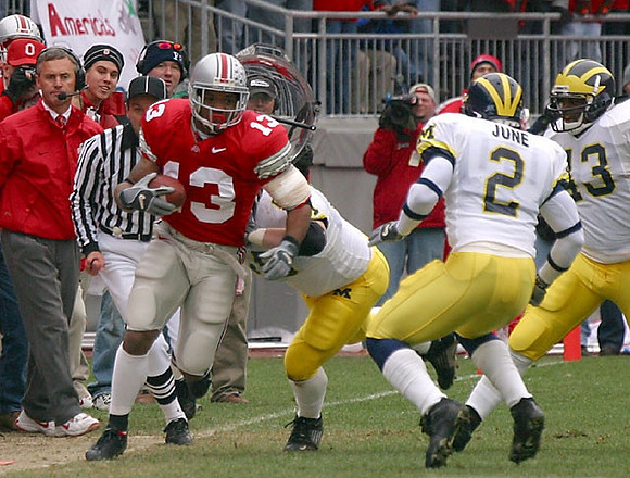 Jim Tressel, Cato June (2), and Carl Diggs (43)