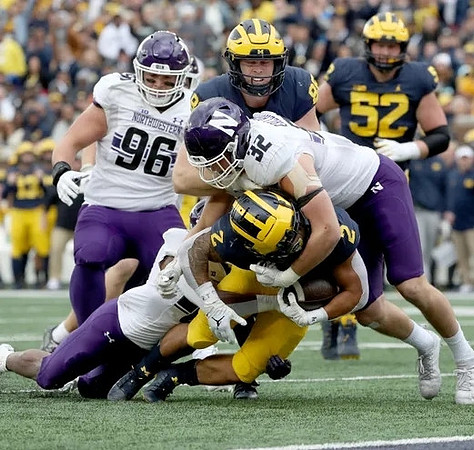 Blake Corum (2), Matthew Hibner (88), and Karsen Barnhart (52)
