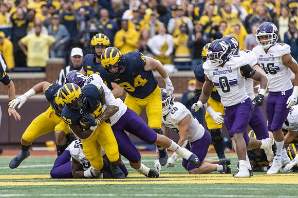 Hassan Haskins (25) and Joel Honigford (84)