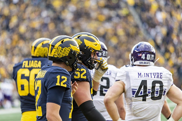 Chuck Filiaga (66), Cade McNamara (12), and Karsen Barnhart (52)
