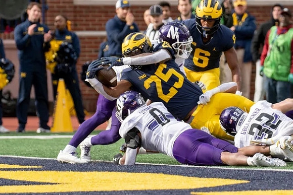 Hassan Haskins (25) and Cornelius Johnson (6)
