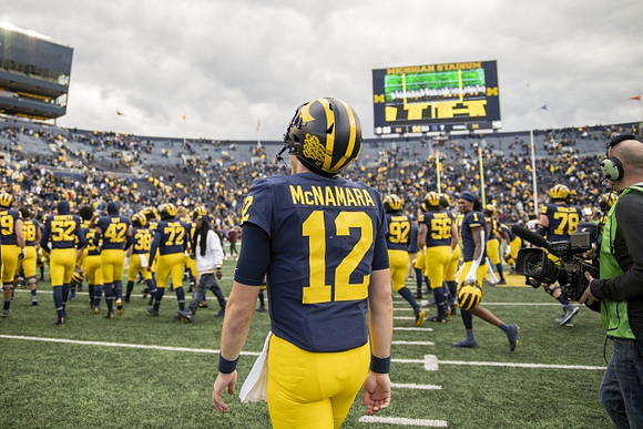 Cade McNamara (12) and Michigan Team