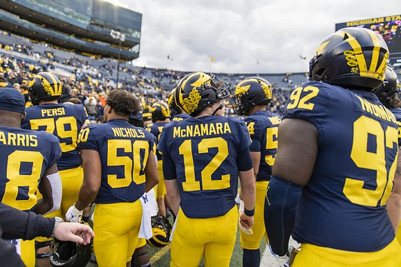 Keshaun Harris (18), Jeffrey Persi (79), Jerome Nichols (50), Cade McNamara (12), George Rooks (54), and Ike Iwunnah (92)