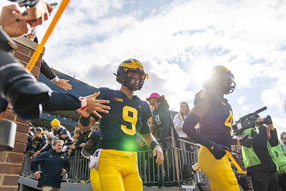 J.J. McCarthy (9) and Dan Villari (4)