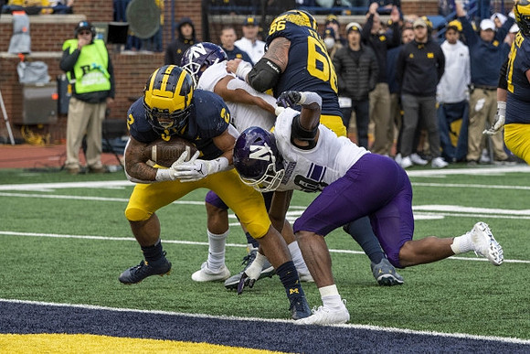 Blake Corum (2) and Chuck Filiaga (66)