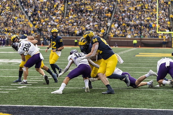 Cade McNamara (12) and Joel Honigford (84)