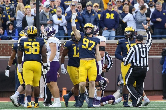 Mazi Smith (58), Josh Ross (12), Aidan Hutchinson (97), and Christopher Hinton (15)