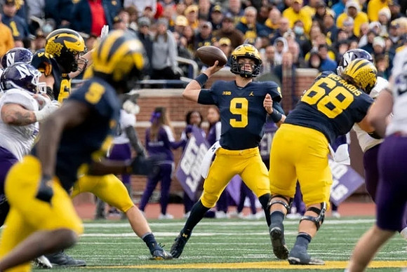 Mike Sainristil (5), J.J. McCarthy (9), and Andrew Vastardis (68)