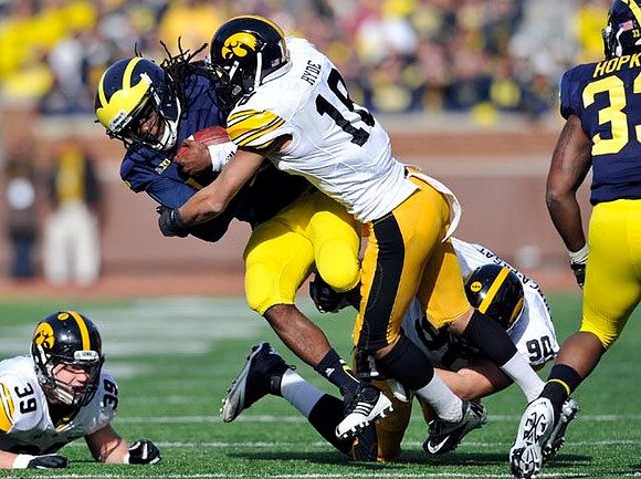 Denard Robinson (16) and Stephen Hopkins (33)