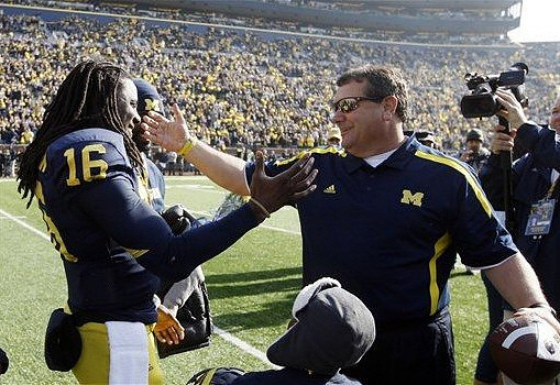 Denard Robinson (16) and Brady Hoke