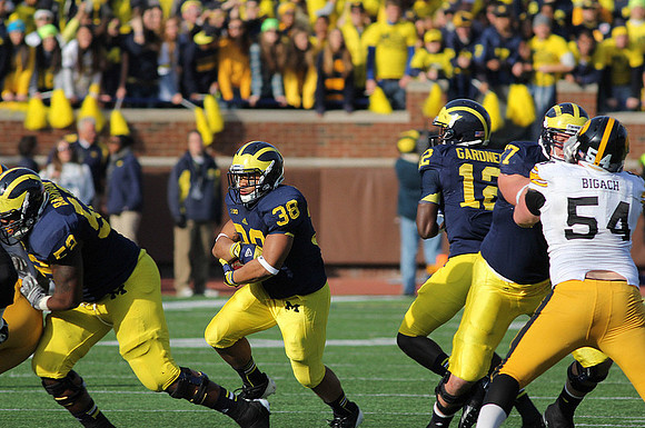 Ricky Barnum (52), Thomas Rawls (38), Devin Gardner (12), and Taylor Lewan (77)