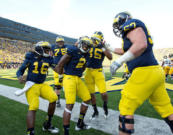 Denard Robinson (16), Vincent Smith (2), Michael Schofield (75), Joe Reynolds (85), and Elliott Mealer (57)
