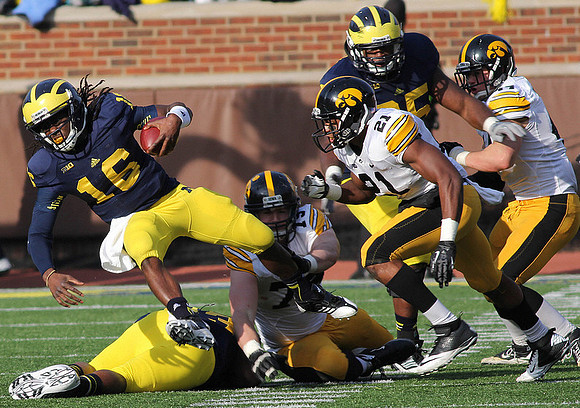 Denard Robinson (16) and Patrick Omameh (65)