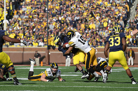 Vincent Smith (2), Patrick Omameh (65), Denard Robinson (16), and Stephen Hopkins (33)