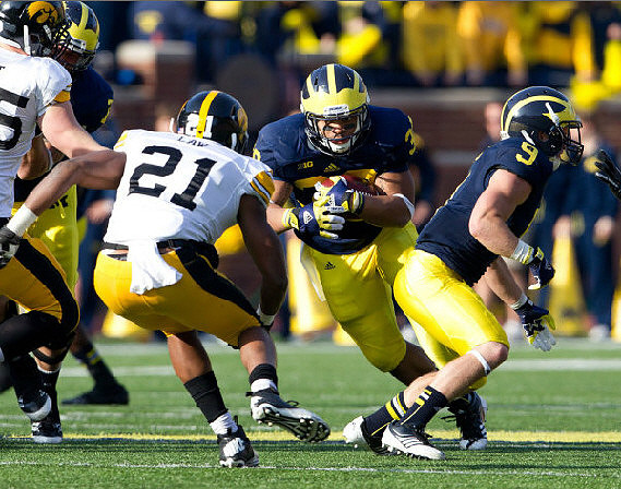 Michael Schofield (75), Drew Dileo (9), and Thomas Rawls (38)