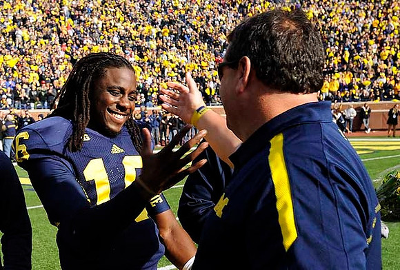 Denard Robinson (16) and Brady Hoke