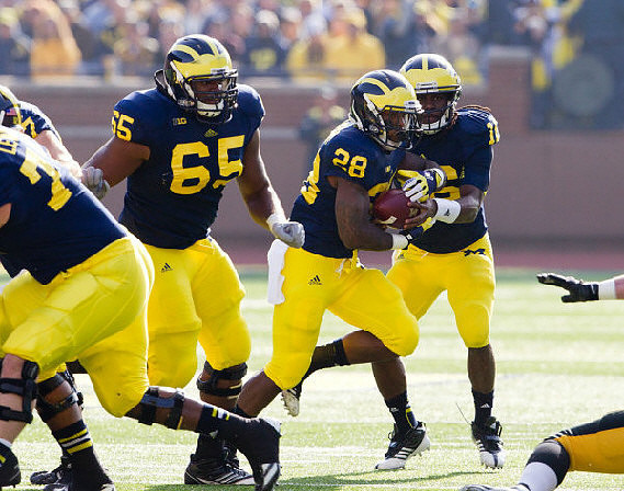 Taylor Lewan (77), Patrick Omameh (65), Fitzgerald Toussaint (28), and Denard Robinson (16)