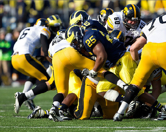 Kenny Demens (25) and James Ross (15)
