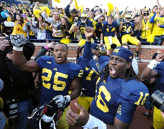 Kenny Demens (25), Brandin Hawthorne (7), Denard Robinson (16), Joe Reynolds (85), Jack Kennedy (14), and Jeremy Clark (34)
