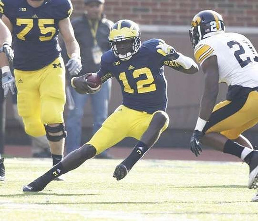 Michael Schofield (75) and Devin Gardner (12)