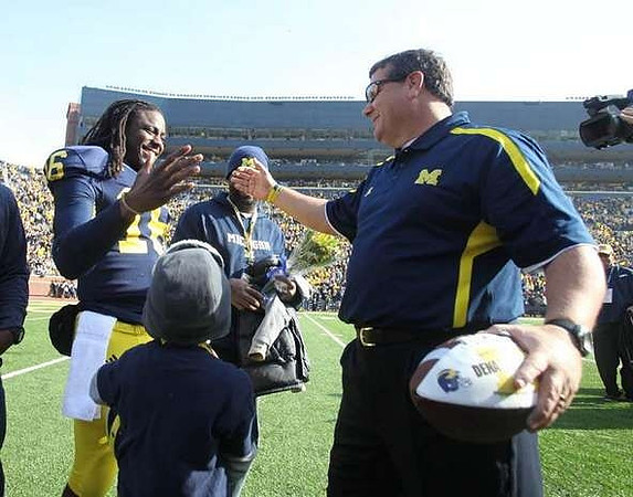 Denard Robinson (16) and Brady Hoke