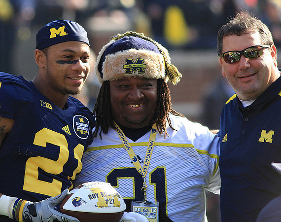 Roy Roundtree (21) and Brady Hoke