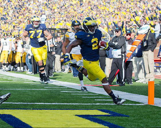 Vincent Smith (2) and Taylor Lewan (77)