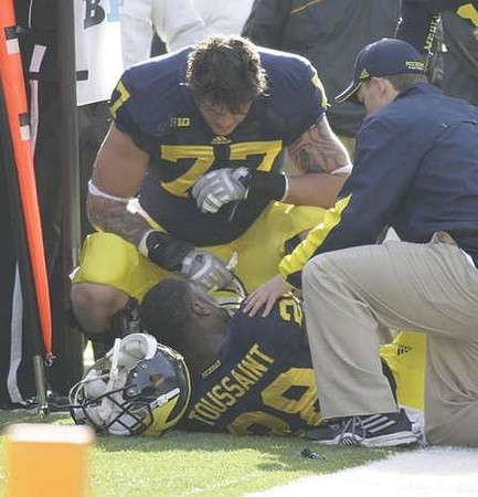 Fitzgerald Toussaint (28) and Taylor Lewan (77)