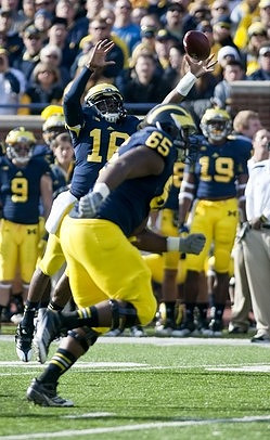 Patrick Omameh (65) and Denard Robinson (16)