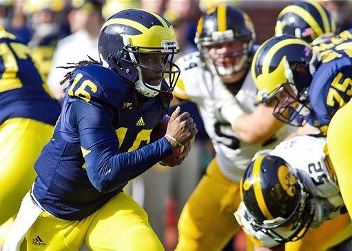 Denard Robinson (16), Taylor Lewan (77), and Michael Schofield (75)