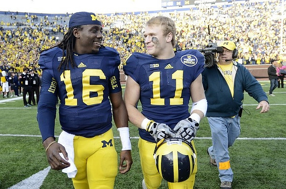 Denard Robinson (16) and Jordan Kovacs (11)