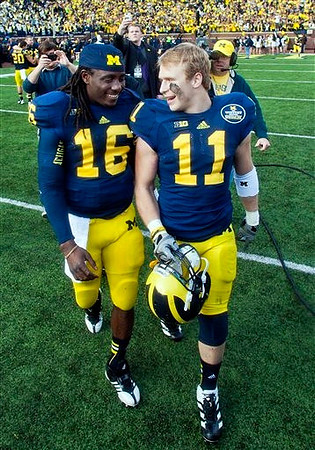 Denard Robinson (16) and Jordan Kovacs (11)