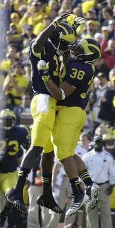 Devin Gardner (12) and Thomas Rawls (38)